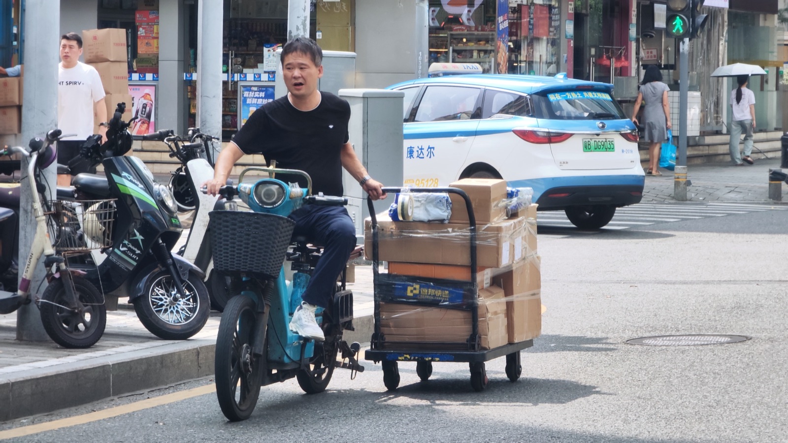 Scooter delivery in Huaqiangbei — components move fast in Shenzhen